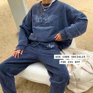 Grey acid wash sweatpants with “angel” written